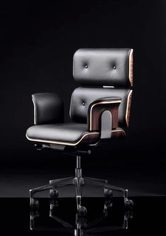 an office chair with black leather upholstered on the back