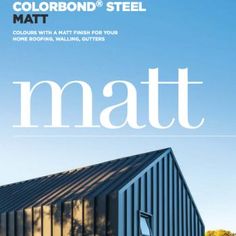 a magazine cover with a black metal building and trees in the backgroung