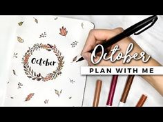 a person holding a pen and writing on a paper with the words october plan with me