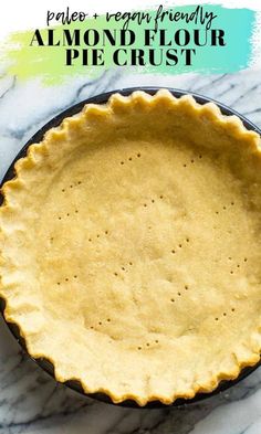 an uncooked pie crust sitting on top of a marble counter with text overlay