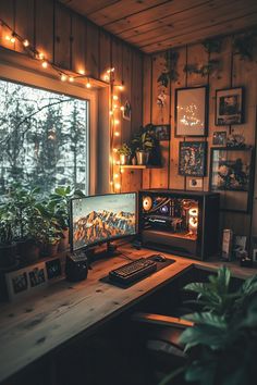 a desktop computer sitting on top of a wooden desk in front of a large window