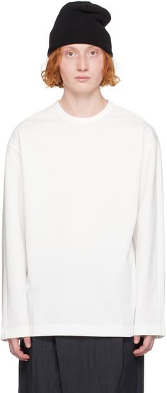 Loose-fit cotton jersey T-shirt. · Rib knit crewneck · Logo embroidered at chest · Logo hardware at side seam Supplier color: White Classic Cotton T-shirt, Crew Neck Cotton T-shirt With Ribbed Cuffs, Oversized Crew Neck T-shirt With Ribbed Cuffs, Basic Crew Neck Top With Double-needle Sleeve, White Crew Neck Sweater With Ribbed Neckline, Basic Crew Neck Tops With Ribbed Cuffs, Classic Crew Neck T-shirt With Ribbed Cuffs, White Sweatshirt With Ribbed Crew Neck, White Crew Neck Sweatshirt With Ribbed Neckline