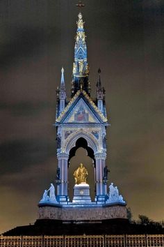 the clock tower is lit up at night