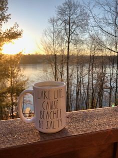 a coffee mug that says lake life cause beaches be salty sitting on a wooden ledge