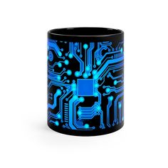 a black and blue coffee mug with an electronic circuit printed on the inside of it