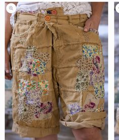 the shorts are decorated with colorful flowers and buttons on them, but not all have holes in them