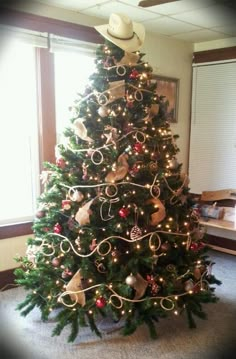 a decorated christmas tree in the corner of a room