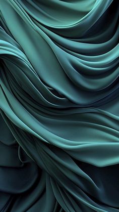 an abstract photo of blue and green wavy fabric