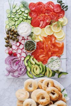 an assortment of vegetables and pretzels on a platter