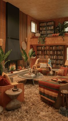 a living room filled with lots of furniture and bookshelves next to a fire place