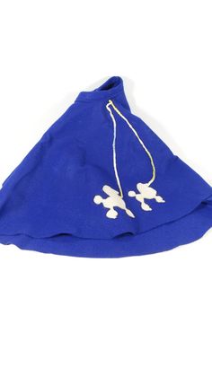 a blue hat with white flowers on it