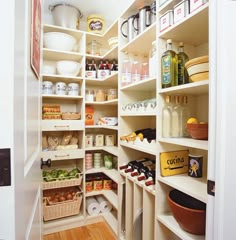 the pantry is stocked with many different types of food