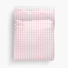 a pink and white checkered bed spread