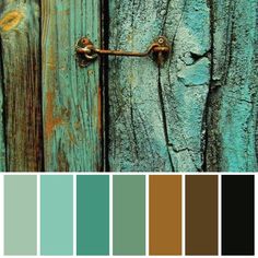 an old wooden door with rusted metal handles and knobs in shades of teal, brown, blue, and green