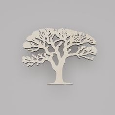 a wooden cutout of a tree on a gray background