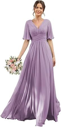 a woman in a long purple dress holding a bouquet