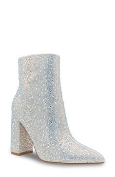 Sparkling crystals add undeniable glamour to a pointy-toe bootie lifted by a bold block heel. 3 1/4" heel 6" shaft Side zip closure Cushioned footbed Synthetic upper, lining and sole Imported Glamorous Embellished Ankle Boots, Sparkling High Heel Evening Boots, Glamorous Ankle Boot Heels With Reinforced Heel, Glamorous Ankle Boots With Reinforced Heel, Glamorous Ankle Heeled Boots With Reinforced Heel, Glamorous Embellished Heeled Boots With Pointed Toe, Glamorous Evening Heeled Boots With Block Heel, Glamorous Ankle Boots For Formal Occasions, Glamorous Silver Boots With Reinforced Heel