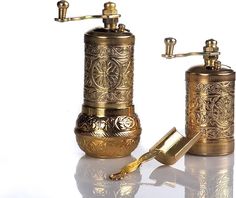 two antique brass bathroom accessories on a white background