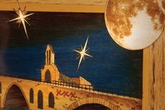 a painting of a bridge with a star above it and a clock on the wall