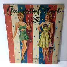 an old fashion magazine cover with two women in dresses on the front and one wearing a bow tie