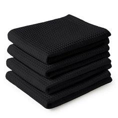 four black towels stacked on top of each other