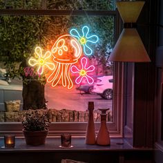 an image of a neon sign on the side of a window that is lit up