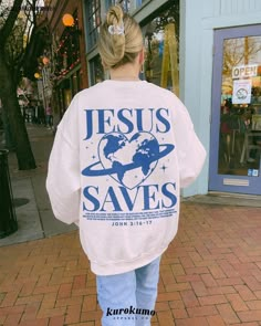 "This Unisex crewneck sweatshirt features \"Jesus Saves | For God so loved the world that he gave his one and only Son, that whoever believes in him shall not perish but have eternal life. For God did not send his Son into the world to condemn the world, but to save the world through him. - John 3:16-17\" with a trendy Y2K planet earth in a heart shape. Spread love and hope with this Christian sweater <3 Make sure to check out the other garment options below :) » O P T I O N S « ‣ Tshirt: https: Crewneck Aesthetic, Earth Graphic, Love Bible, Thanksgiving Sweater, Aesthetic Christian, Christian Streetwear