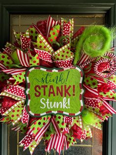 a green and red wreath with the words stink st patrick's day on it