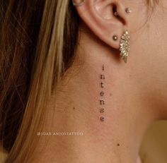 a woman's back neck with the words i love you written on her left side