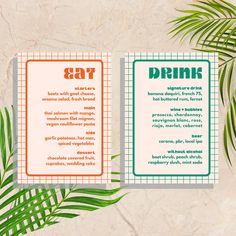 two brochures with the words eat and drink on them next to palm leaves