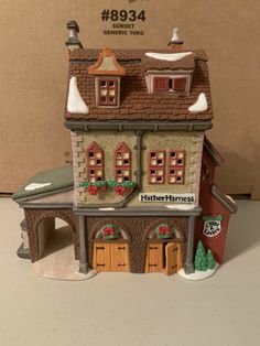 a toy house is shown on a table