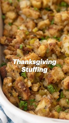 a casserole dish with stuffing and vegetables in it on a blue and white towel