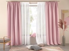 a living room with pink and white curtains