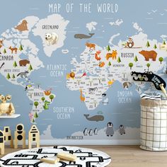 a map of the world with animals and trees on it in a children's room