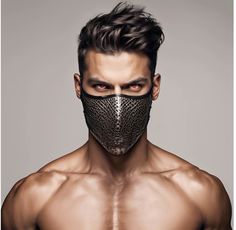 a shirtless man with a mask on his face