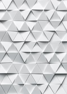 an abstract white background consisting of triangles and rectangles that appear to have been folded together