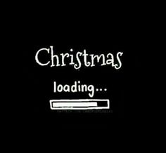 a computer screen with the words christmas loading on it in red and black texting