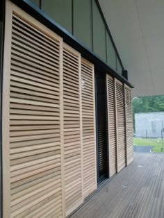 the outside of a building with wooden slats on it