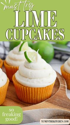 lime cupcakes with white frosting on a cutting board