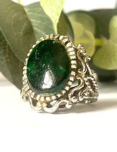 This vintage statement ring features a substantial silver tone band and setting. This ring has a dark green faux stone cab. The dark green cab has some scratching on it. Please see this in the photos. This ring is a size 5.  Please be aware that we are not jewelry experts. We have a sincere love of all things vintage especially vintage jewelry. We hope to share our finds with you. That being said, we describe our items to the very best of our ability. Please view all photos and know that each phone or computer screen may display slightly different colors. Please ask any and all questions. We gladly accept returns and provide shop credit or refund upon receiving the item back. The buyer pays return shipping unless the item is grossly damaged. In that case, please send us a photo of the dama Faux Stone, Green Stone, Statement Ring, Rings Statement, Different Colors, Statement Rings, Dark Green, Etsy Accessories, Vintage Jewelry