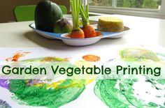 a table topped with plates filled with fruit and veggies next to a window