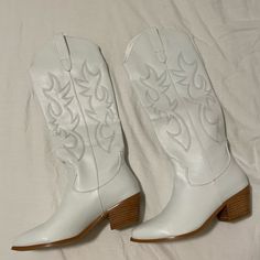 Brand New, Never Worn, Original Packaging. White Cowboy Boots. True Size 7. In Perfect Condition. Trendy White Wide Calf Boots, White Snip Toe Boots For Spring, White Almond Toe Synthetic Boots, White Synthetic Almond Toe Boots, White Synthetic Boots With Almond Toe, Casual Spring Boots With Snip Toe, Casual Snip Toe Boots For Spring, White Wide Calf Boots With Reinforced Heel, White Wide Calf Boots With Snip Toe