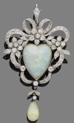 Handmade item Recycling: No Brooch & pendant weight: 18.540 Grams Gemstone: Rose Cut diamond , Pearl & Opal Diamond weight: 8.45 carats Diamond colure: Tinted Brown Diamond shape : Round Opal weight: 19.75 carats Pearl weight: 4.40 carats Metal: Silver sterling silver Purity: 925 Finished: White & Gold Ornate Diamond Brooch As Gift, Ornate Diamond Brooch Gift, Diamond Jeweled Brooch As Gift, Fine Jewelry Brooches With Diamond Accents For Gifts, Diamond Jewels Brooches As Gifts, Elegant Brooch For Valentine's Day, Elegant Heart Shaped Brooch Jewelry, Vintage Diamond White Brooch For Gift, 17 Jewel Pendant Brooches For Gifts