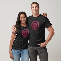 a man and woman standing next to each other wearing t - shirts with the word love on them