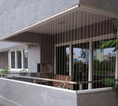 an outside view of a house with glass doors