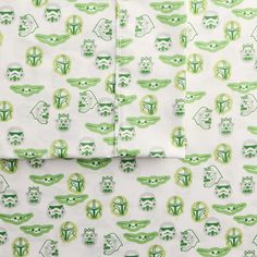 the green and white bedding has an image of star wars on it's sheets