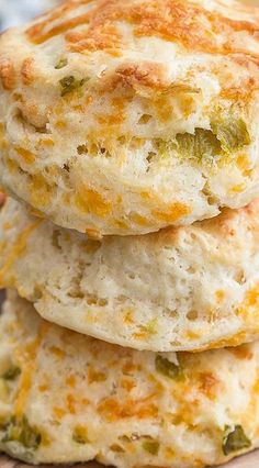 three cheesy biscuits stacked on top of each other