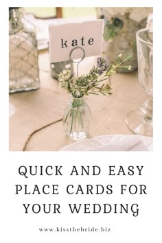 a table with flowers and place cards on it