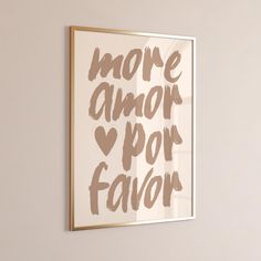 a framed art print with the words more armor, por flavor in brown on a white wall