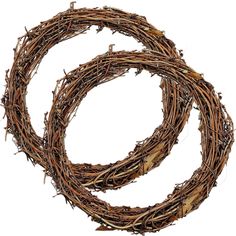 two wreaths made out of twigs on a white background